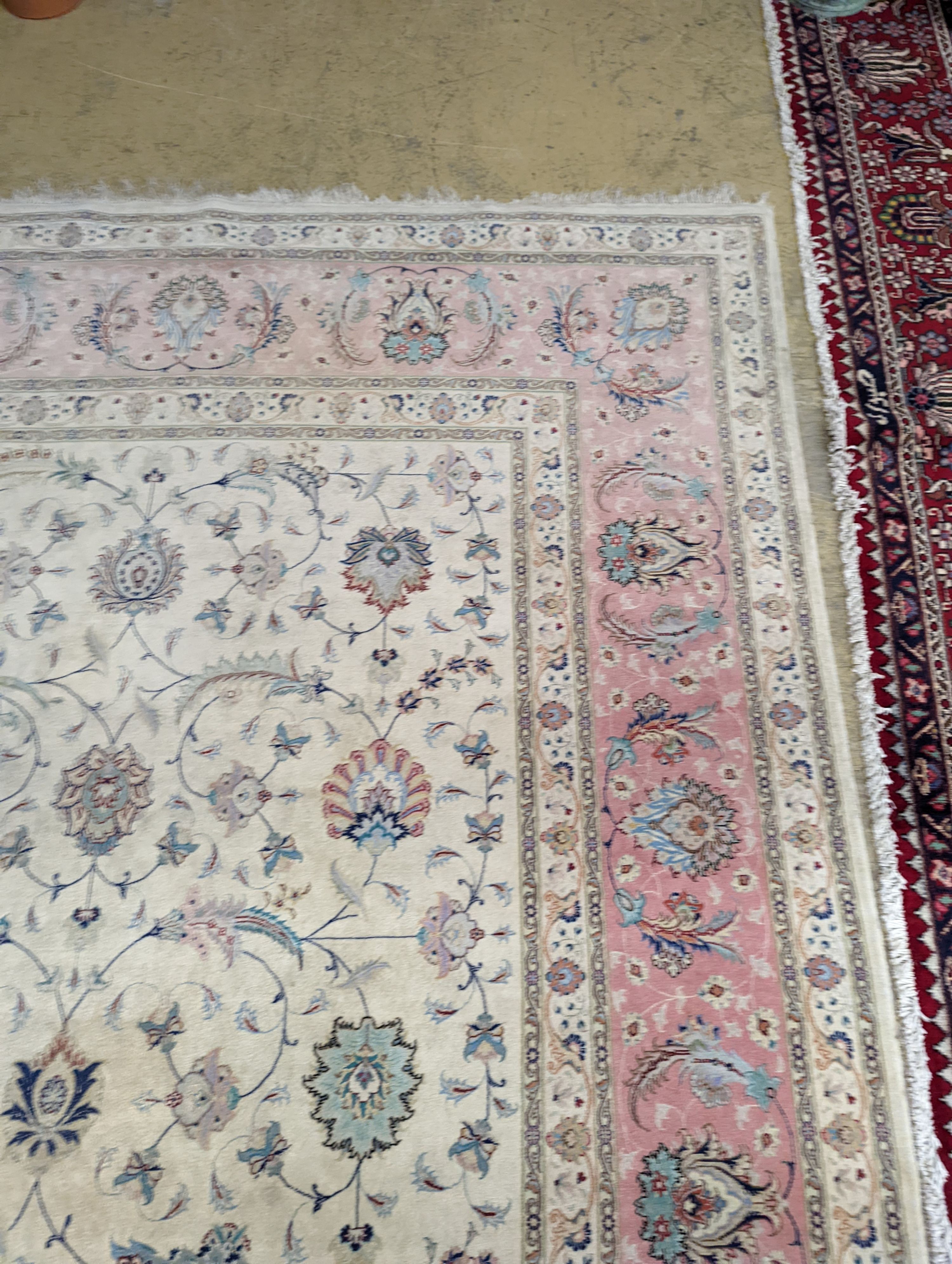 A Persian Tabriz ivory ground carpet, 410 x 300